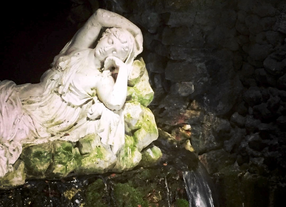 Statue of a sleeping water nymph in the Grotto at Stourhead, Wiltshire